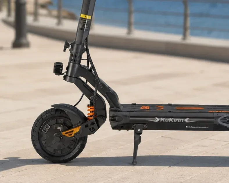 Kukirin G2, G2 Master and G4 electric scooters side by side on a private road