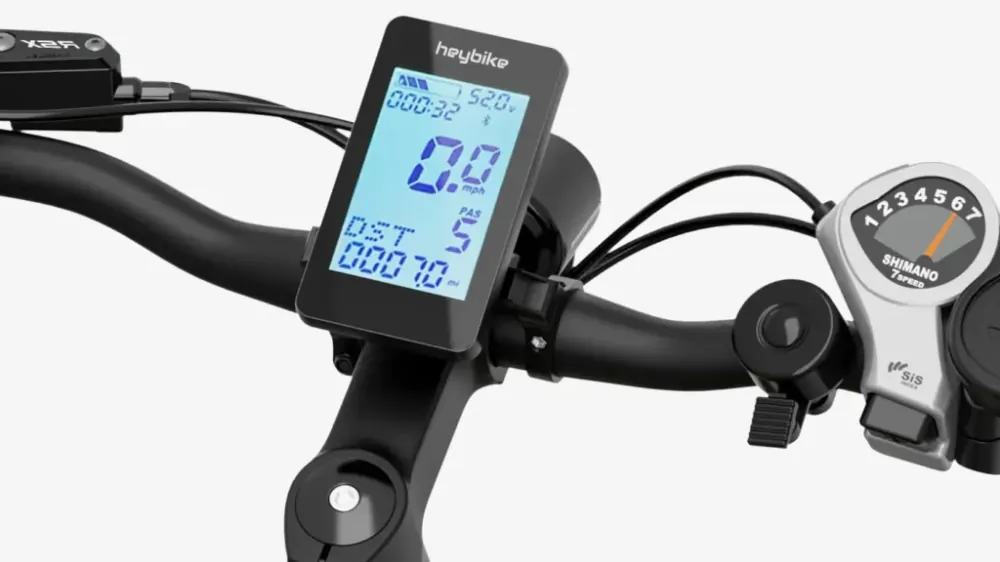 Heybike EC 1-ST electric bike in black, full side view with step-through frame and city background.