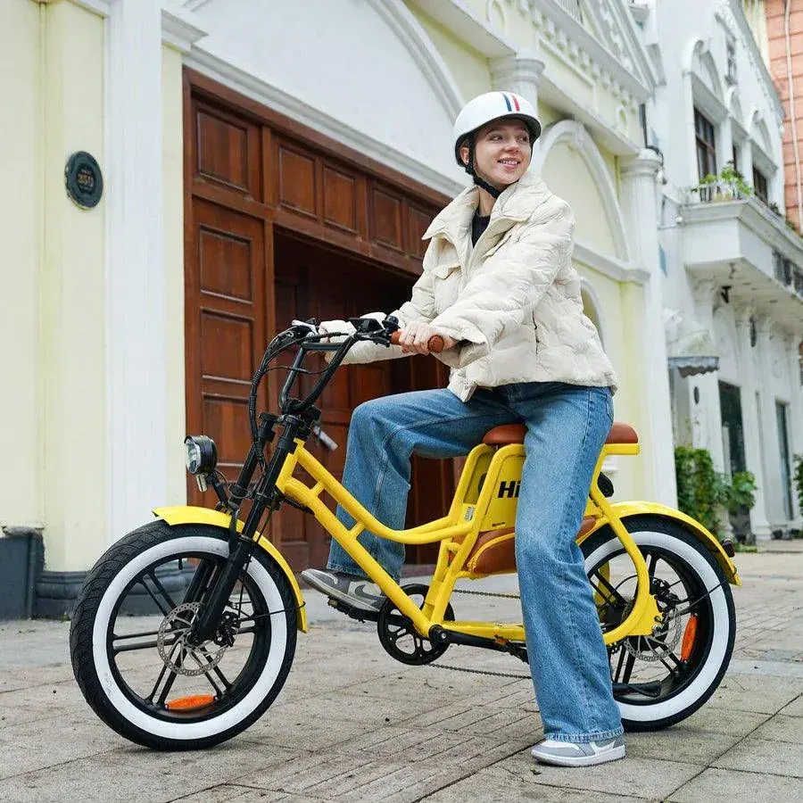 Hidoes C8 electric bike being ridden on a city street, commuter in motion
