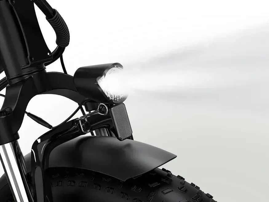 Rider on Koolux BK6S 4.0 e-bike riding on a gravel path, front suspension active.