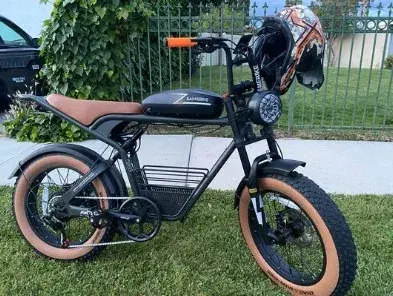 Samebike M20 battery pack mounted on frame, with charging port visible.