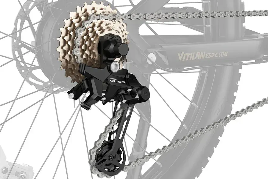 Vitilan M5 front fork and CST 27.5-inch tire with puncture-resistant liner on rocky terrain.